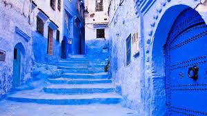 Vibrant view of the bustling Marrakech Medina in Morocco, with colorful markets, historic architecture, and lively street scenes